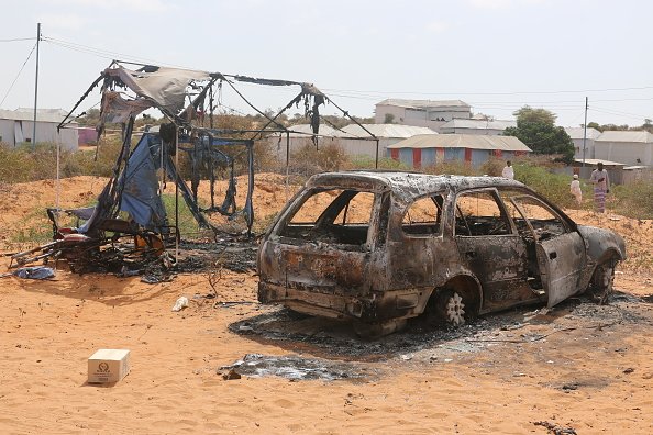Burnt-out car and destroyed shelter after attack in Somalia