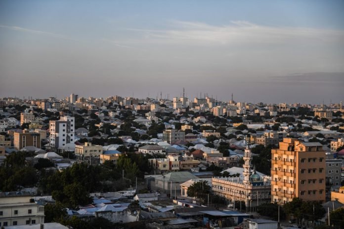 Aerial view of Mogadishu, Somalia, showing urban landscape, coastal areas, and key buildings